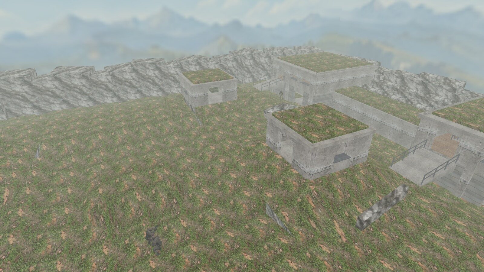 Elevated view of operators moving across the Outpost hillside between concrete bunkers